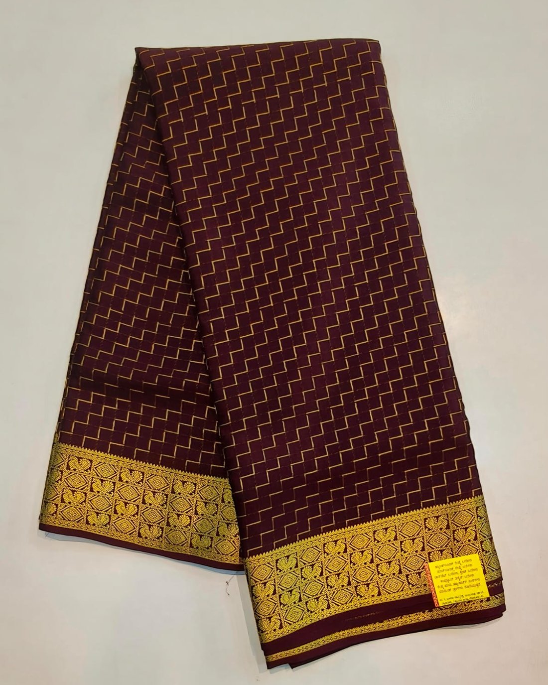 Deep maroon pure Mysore silk crape saree with gold zigzag weave and broad zari border