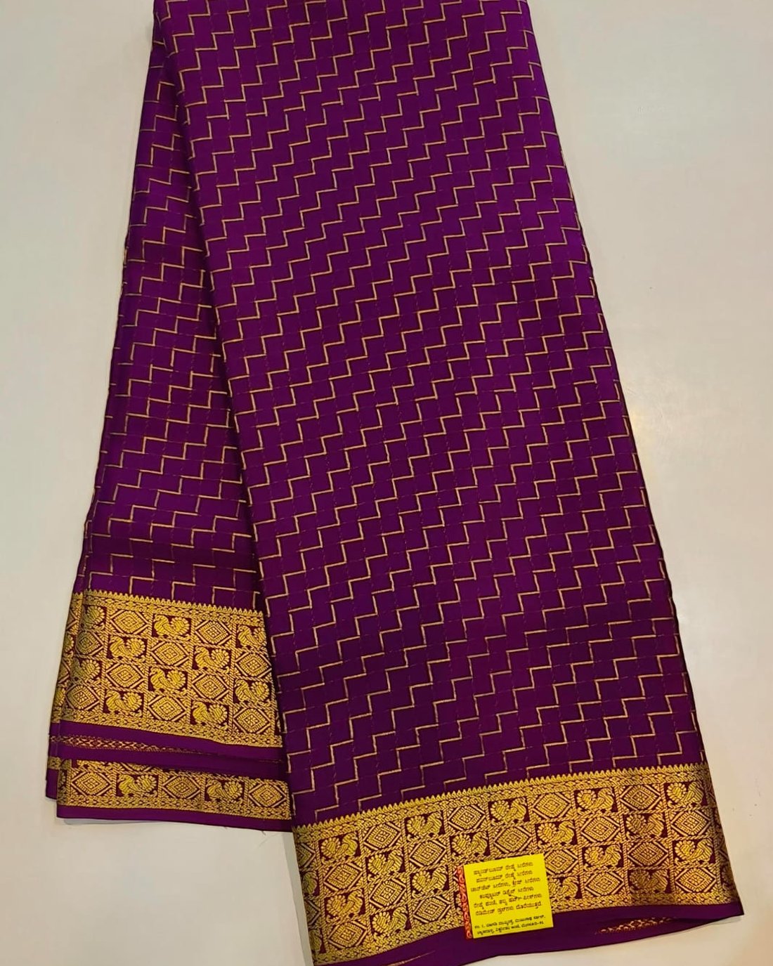 Purple pure Mysore silk crape saree with gold zigzag weave and rich zari pallu border